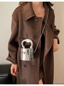 Glossy silver metallic cylinder mini bag with unique arched handle and chain strap