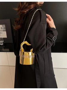 Glossy gold cylindrical bucket bag with creative metal handle and chain strap for women