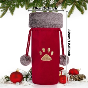 Detail of red velvet wine bottle bag with gold paw embroidery and 16x32cm dimensions
