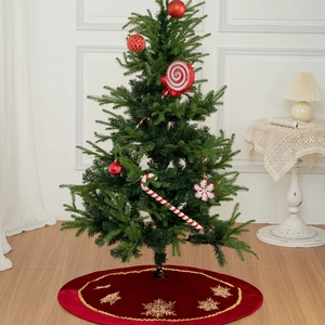 Red velvet Christmas tree skirt with gold sequined snowflake embroidery and wavy borders
