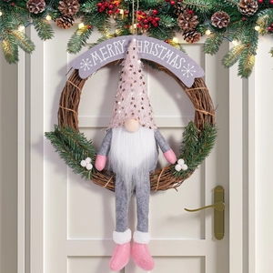 Detail of Christmas gnome wreath with pink sequin hat and Merry Christmas sign