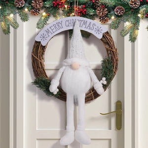 Close-up of a Christmas wreath with a white sequin gnome on a natural rattan ring