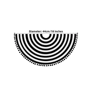 Detail of 44cm semi-circle woven placemat with black and white stripes and pom-pom trim