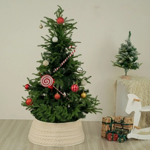 Detail view of ivory cable knit Christmas tree skirt with thick woven texture