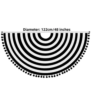 Macro detail of 48 inch black and white striped Christmas tree skirt with pompom trim