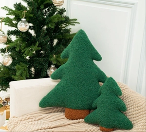Detail of forest green bouclé Christmas tree plush pillow with textured sherpa fabric