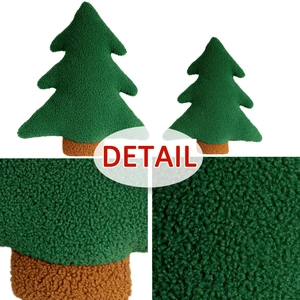 Detailed macro view of plush Christmas tree pillow showing thick sherpa fleece texture
