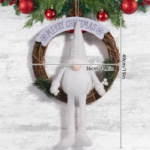 Detail of Christmas gnome wreath with sequins and Merry Christmas banner on wood