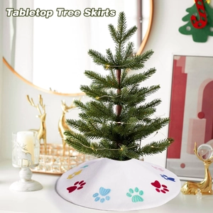 White mini Christmas tree skirt with colorful paw print embroidery for tabletop decor