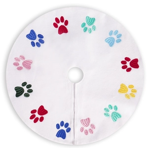 White Christmas tree skirt with colorful dog paw embroidery for festive pet decor