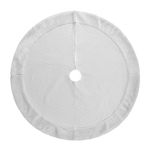 Detail of white quilted Christmas tree skirt featuring luxury plush faux fur trim border