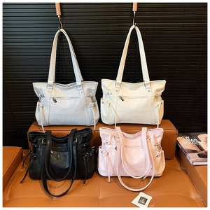 Selection of stylish tote bags in grey, beige, black, and pink with side drawstring details