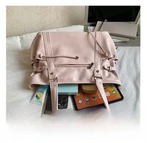 Pink leather tote bag interior view showing large capacity for laptop and daily essentials