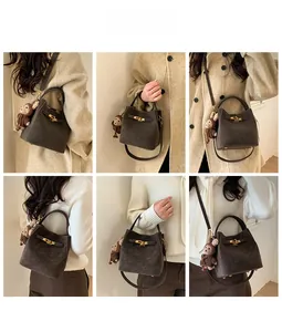 Detailed views of a coffee brown suede bucket bag featuring belt buckle and plush charm