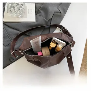 Brown PU leather crescent bag interior showing large capacity for essentials like phone