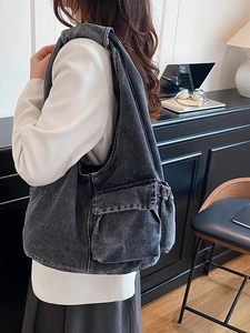 Vintage dark gray denim shoulder tote bag with utility pockets and drawstring details