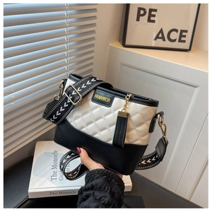 Detail of rhombic quilted bag with FRAWIROR label and geometric pattern strap