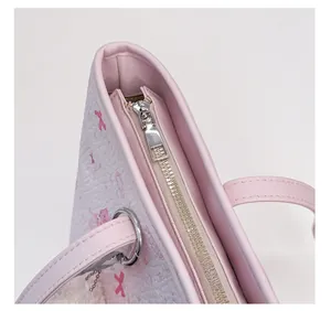 Close-up of durable metal zipper and smooth large puller on a pink cartoon tote bag