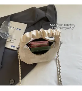 Detailed view of spacious handbag interior showing room for wallet and phone