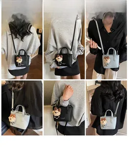 Chic bucket bags in black and blue leather featuring teddy bear charms with polka dot bows