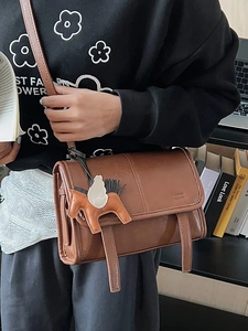 Retro brown leather crossbody bag with decorative straps and pegasus charm for women
