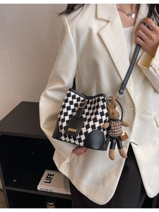 Retro checkered bucket bag with black leather trim and cute rabbit plush charm