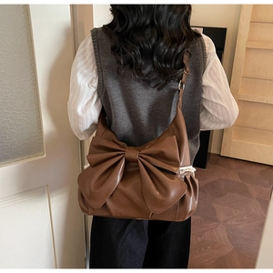Brown vintage faux leather shoulder bag with large bow and lace trim detail