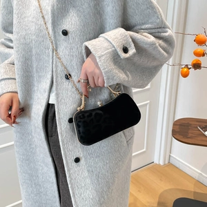 Elegant black leopard texture velvet evening bag with gold chain and rhinestone clasp