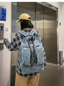 Vintage wash denim backpack for travel and students with drawstring and side pockets