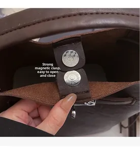 Detail of strong magnetic clasp on coffee brown vintage leather bucket bag for easy access