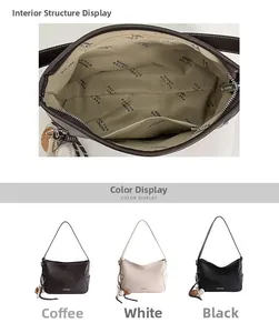 Detail of spacious tote bag interior showing the zipper pocket and baseball charm accessory