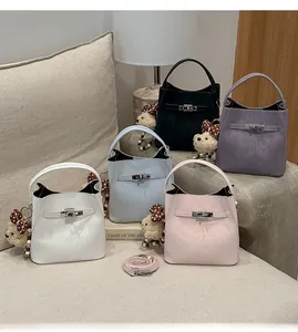Detailed collection of colorful lychee grain bucket bags with cute teddy bear pendants