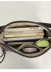 Interior view of large capacity tote bag with compartments for daily commute essentials