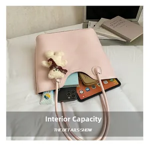 Pink large capacity shoulder bag showing interior space with tablet and cosmetics