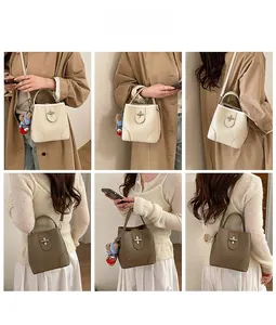 Litchi pattern bucket bag styled with trench coat and plush bear charm detail