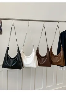 Detailed display of vintage hobo bags in four colors with leather and chain straps