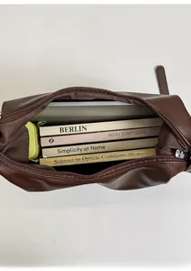 Top view of deep brown tote bag showing large capacity for books and tablet