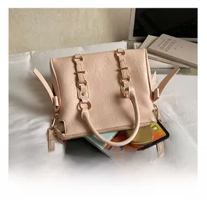 Spacious interior of pink pleated tote bag fitting a tablet, phone, and notebooks