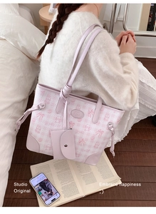 Detail of pink checkerboard tote bag with cute cartoon cat print and mini coin purse