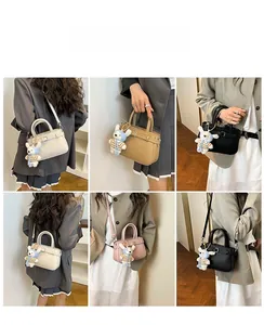 Detailed view of mini crossbody bag in four colors featuring a cute bunny charm