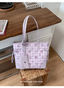 Detail of lavender checkered tote bag with cartoon bear patterns and matching mini pouch