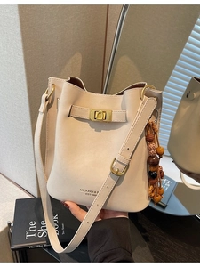 Chic beige PU leather bucket bag with wooden bead tassel and gold metallic lock detail