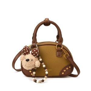 Retro mustard and brown contrast leather pillow handbag with cute plush bear charm