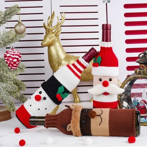 Knitted Christmas wine bottle covers featuring snowman, Santa Claus and reindeer designs