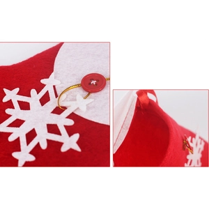 Close-up of red felt Christmas stocking featuring white snowflake and button details