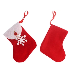 Set of 2 red Christmas felt stockings with white snowflake and button decor for cutlery