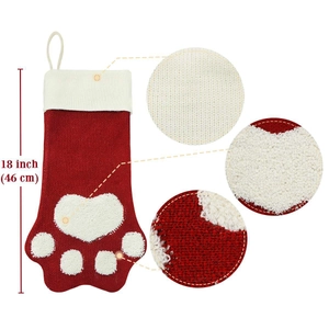 18-inch red and white knitted Christmas stocking with plush dog paw print design