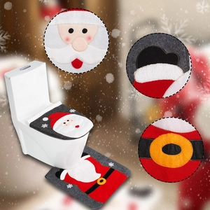 Detail of red Santa toilet seat cover and floor mat set with soft flannel texture