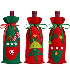 Three-piece Christmas wine bottle cover set with festive embroidery and ribbon ties
