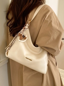 Chic cream white large capacity shoulder tote bag with a decorative horse charm